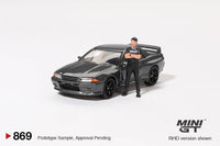 Thumbnail for PRE-ORDER MINI GT 1:64 Nissan Skyline GT-R R32 Nismo Gunmetal W/ Matsuda Figure Tsugio Matsuda Collection MGT00869-R