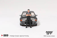 Thumbnail for PRE-ORDER MINI GT 1:64 Nissan Skyline GT-R R32 Nismo Gunmetal W/ Matsuda Figure Tsugio Matsuda Collection MGT00869-R