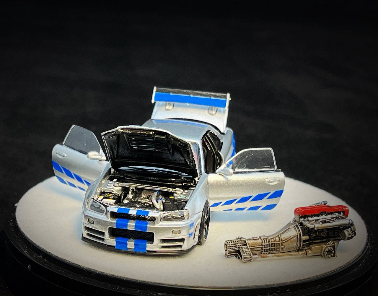 PRE-ORDER PGM 1:64 Nissan GT-R R34 Z-Tune Silver with blue Stripe LUXURY PAUL WALKER