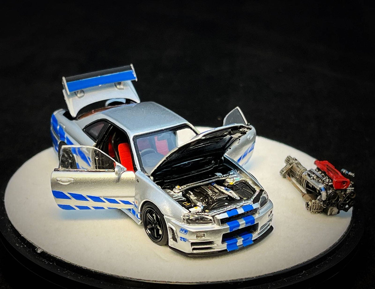 PRE-ORDER PGM 1:64 Nissan GT-R R34 Z-Tune Silver with blue Stripe LUXURY PAUL WALKER