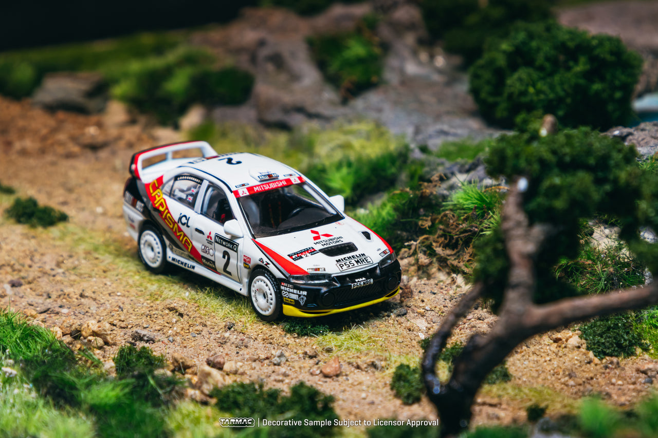 PRE-ORDER Tarmac Works 1:64 Mitsubishi Carisma GT Evolution IV, RAC Rally 1997, Richard Burns / Robert Reid