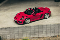 Thumbnail for Minichamps X Tarmac Works 1:64 Porsche 718 Spyder RS Ruby Star Neo