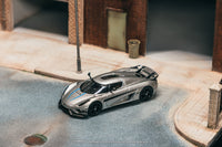 Thumbnail for Tarmac Works 1:64 Koenigsegg Regera, Silver Metallic / Blue Accents w/ Trading Cards